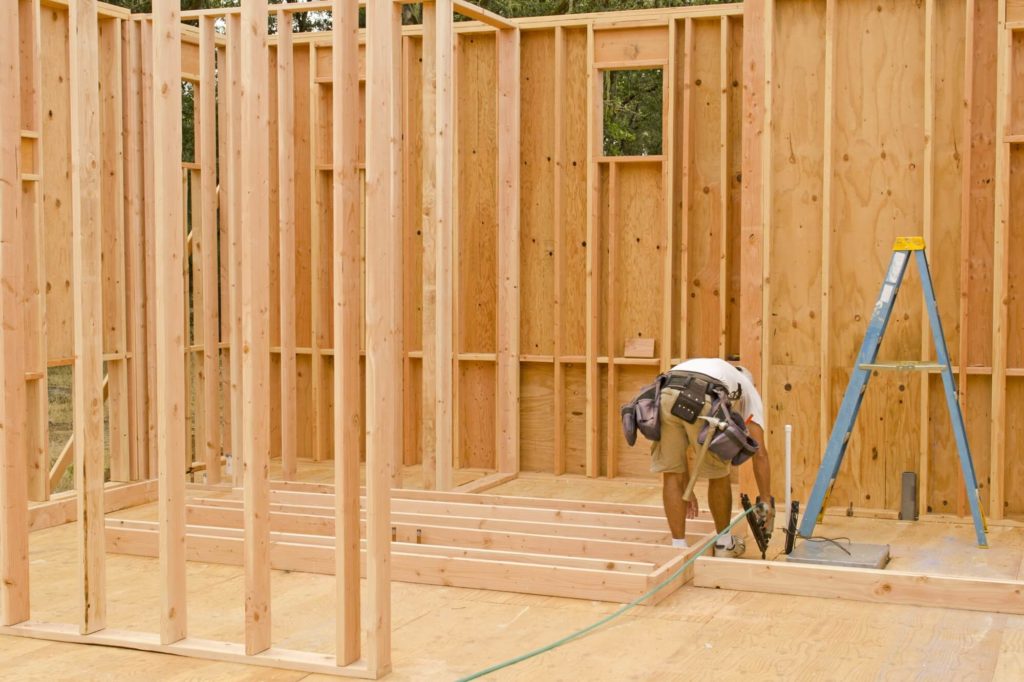 Builder framing the interior walls of a new house