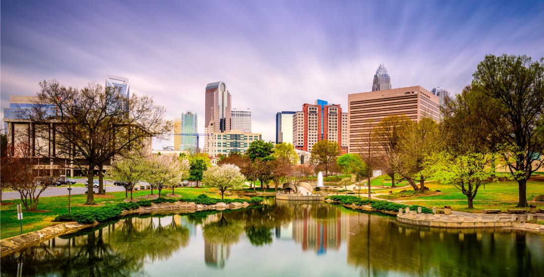 Myer Park in Charlotte - city skyline and pond image