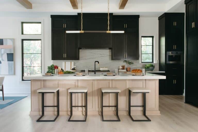 Copper Builders kitchen with black cabinets and a large island