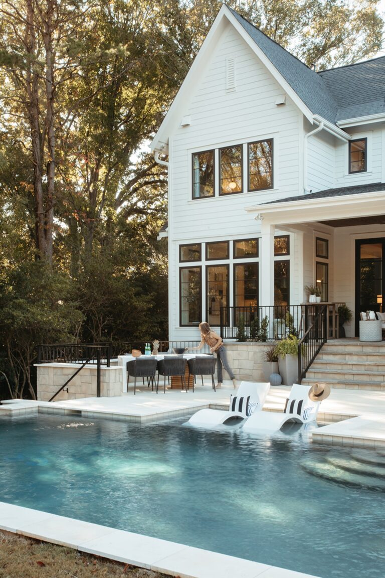 Rear of a Copper Builders home with a pool