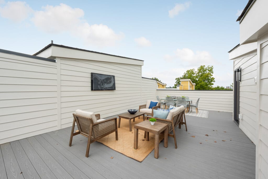 Rooftop terrace with outdoor seating on a new townhome