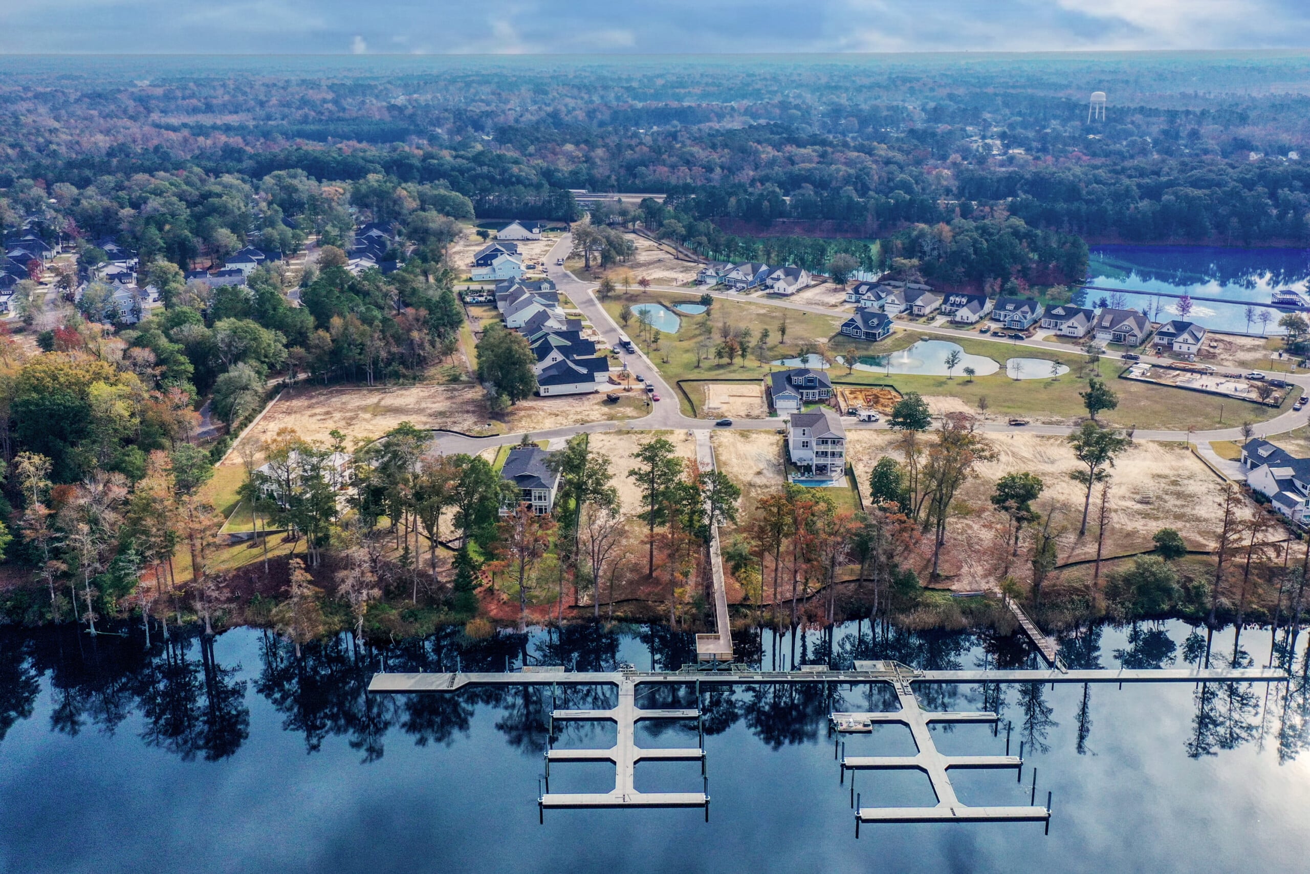 Aerial view of a planned residential community with homes, streets and green space