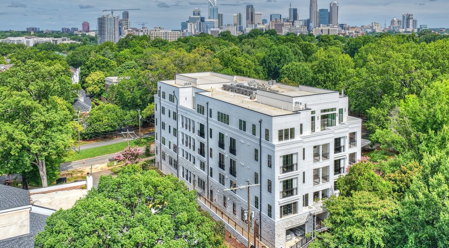 Four09 Queens luxury condominiums in Myers Park with the Charlotte skyline, built by Copper Collaborative