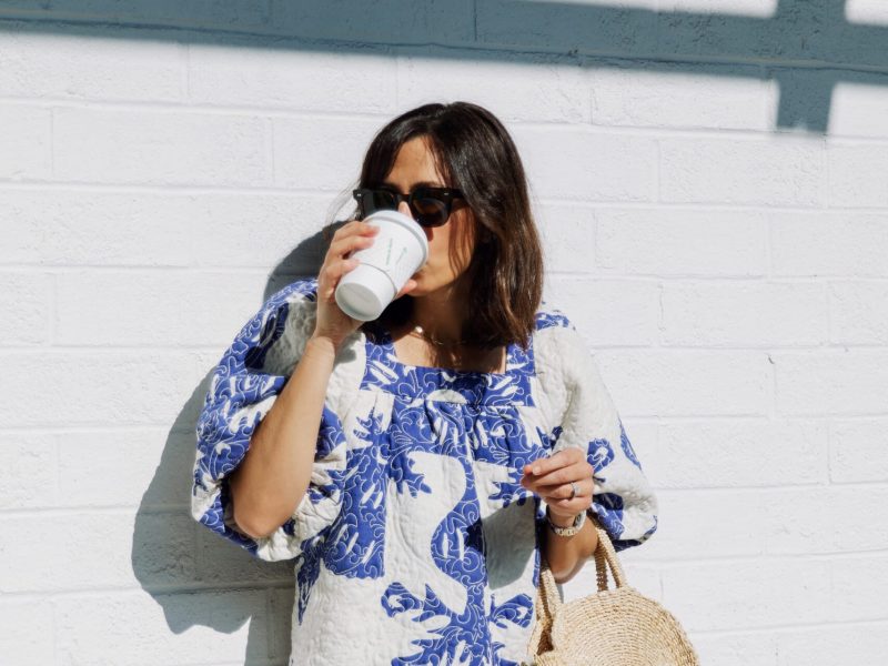 Woman with coffee in downtown Asheville