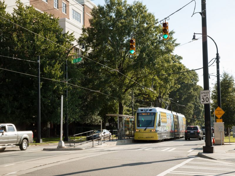 CityLYNX Gold Line streetcar passing shops in Charlotte
