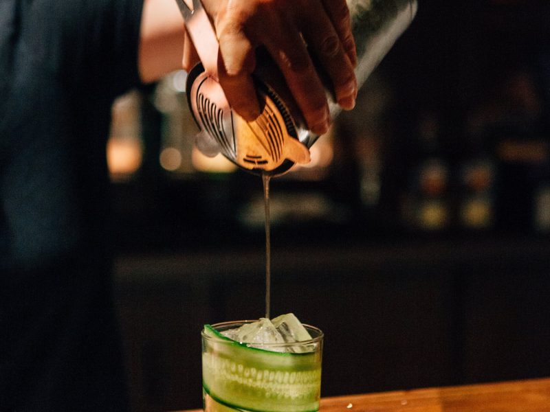 Bartender pouring a cocktail in Asheville